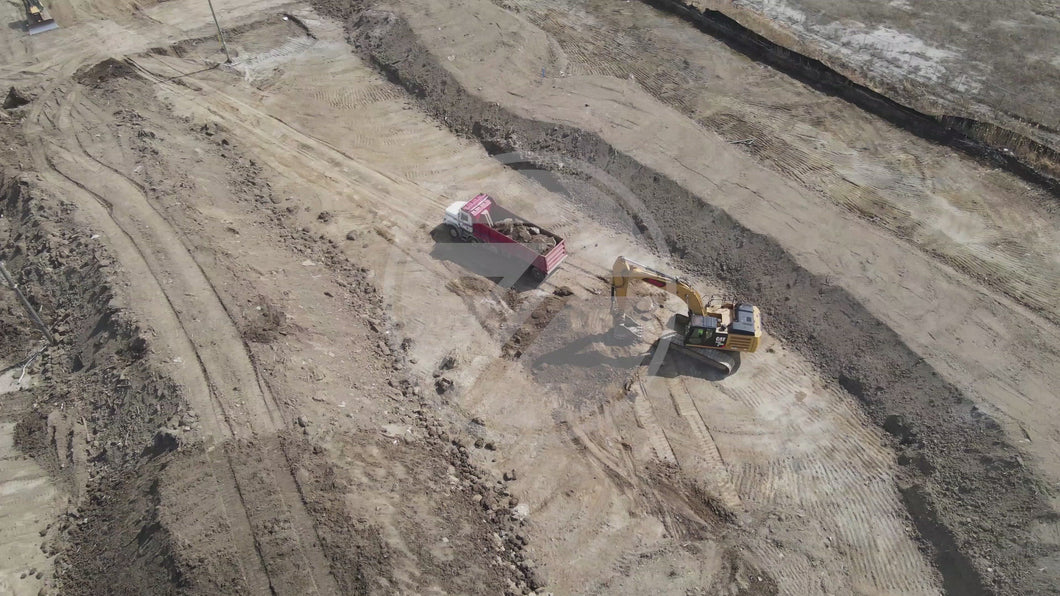 Excavator Dumping In Truck